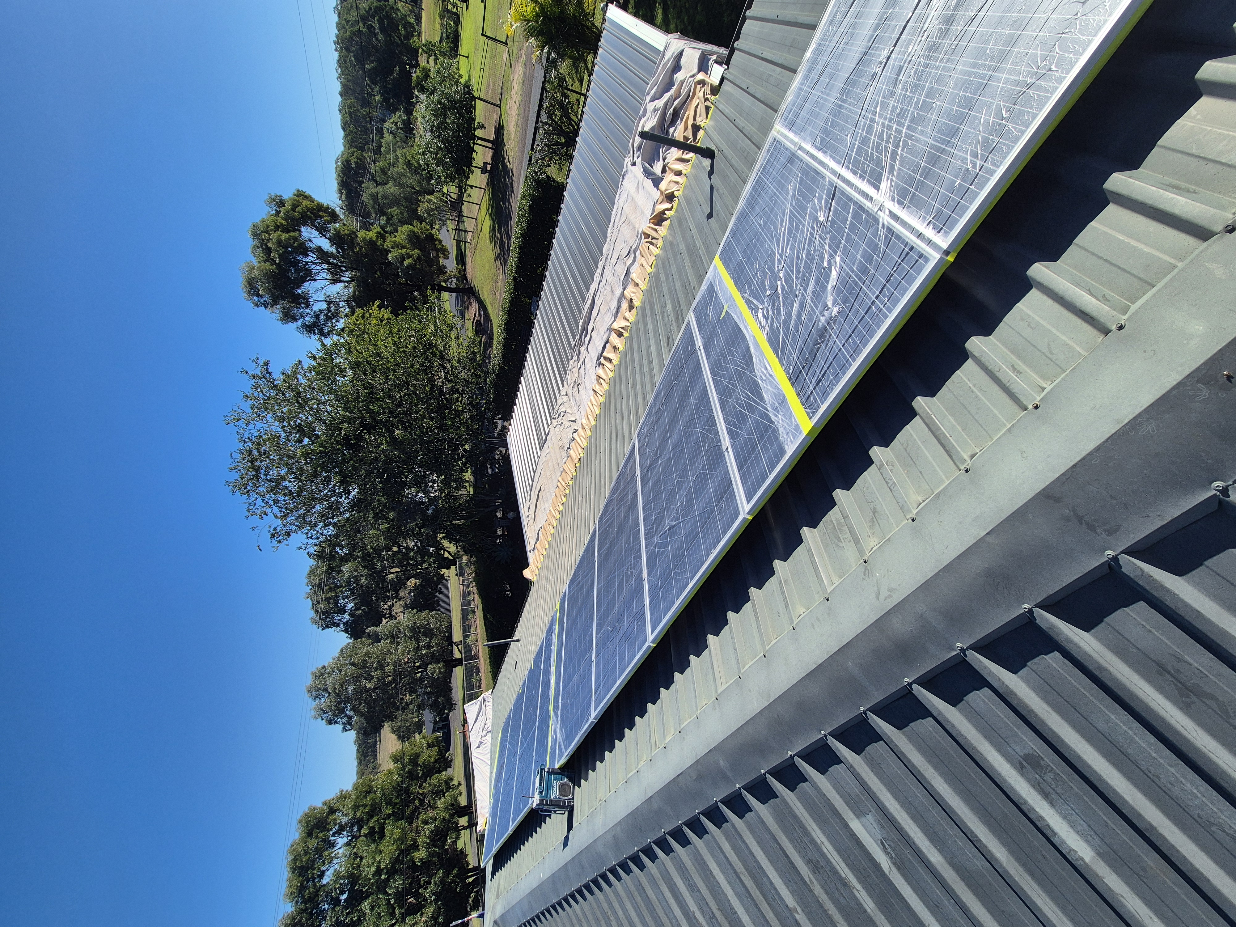 High pressure cleaning a roof back to the bare surface