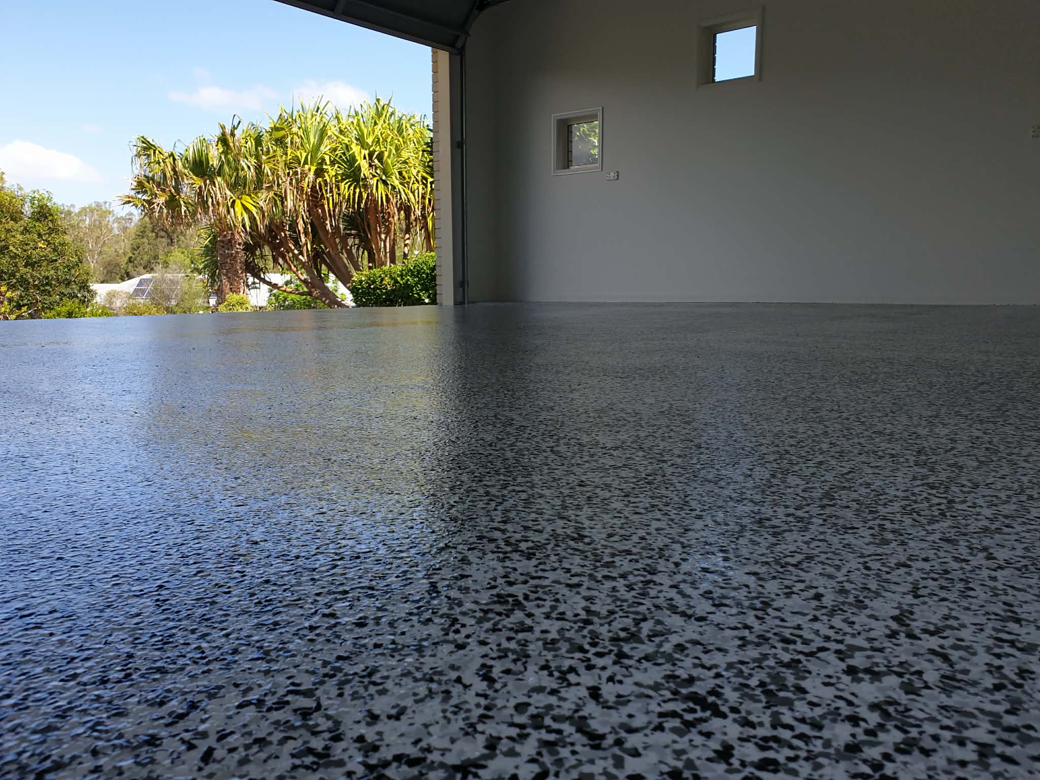 Finished epoxy floor coating in a residential garage