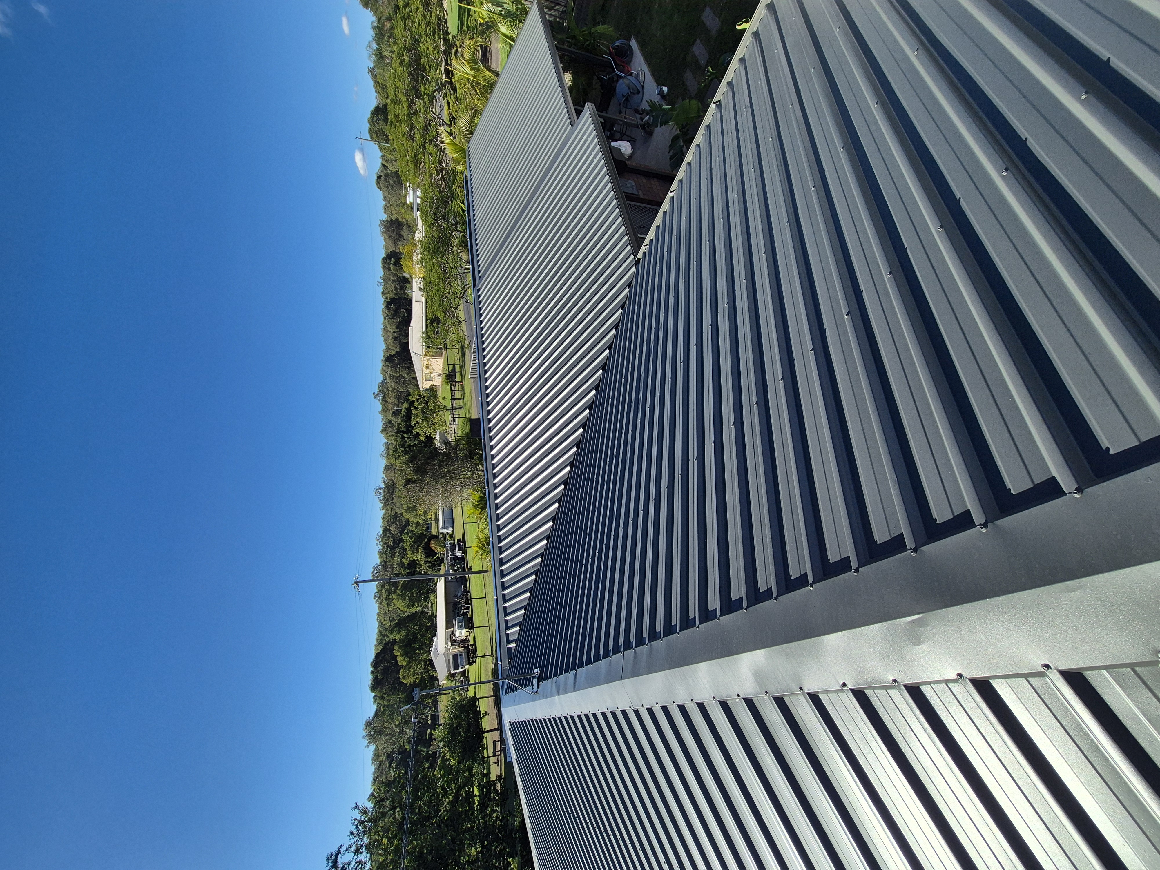Restored roof after a full clean and recoat, wide shot of the roofline